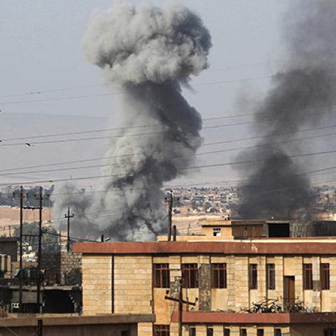 Smoke billows in a neighbourhood called 17 Tammuz following a car bomb explosion, west of Mosul, on May 18, 2017 (AHMAD AL-RUBAYE/AFP/Getty Images)