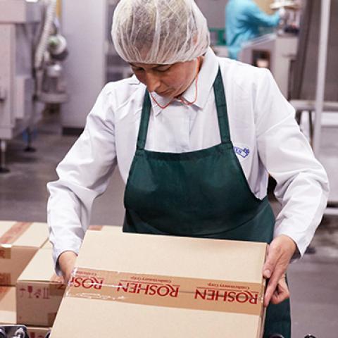 Workers pack chocolate products in factory on June 19, 2016 in Vinnytsia, Ukraine (Vitaliy Holovin/Corbis via Getty images)