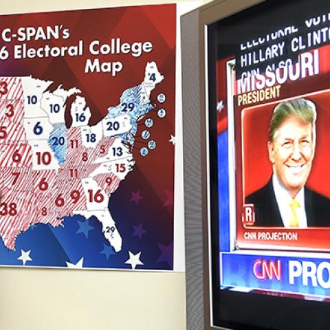 Jake Krupa colors in an electoral map at an election watching party in Coconut Grove, Florida, November 8, 2016 (RHONA WISE/AFP/Getty Images)