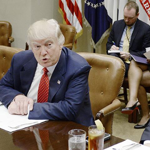 U.S. President Donald Trump discusses the federal budget as Treasury Secretary Steve Mnuchin (R) looks on, February 22, 2017 (Olivier Douliery-Pool/Getty Images)