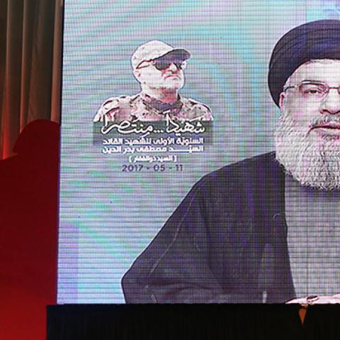 Secretary-General of Hezbollah Hassan Nasrallah live broadcasts during a commemoration event for Mustafa Badreddine, a soldier of Hezbollah killed in Syria, in Dahieh district of Beirut, Lebanon on May 11, 2017 (Ratib Al Safadi/Anadolu Agency/Getty Images