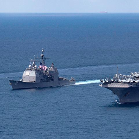 The Arleigh Burke-class guided-missile destroyer USS Michael Murphy and Ticonderoga-class guided-missile cruiser USS Lake Champlain move alongside the aircraft carrier USS Carl Vinson in the Indian Ocean, April 14, 2017 (U.S. Department of Defense)