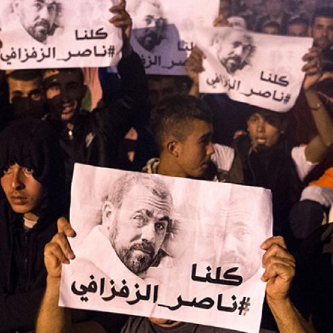 Demonstrators hold pictures of Nasser Zafzafi, leader of the Rif region's protest movement, during a demonstration against corruption, repression and unemployment in the northern city of al-Hoceima, Morocco, May 29, 2017 (FADEL SENNA/Getty Images)