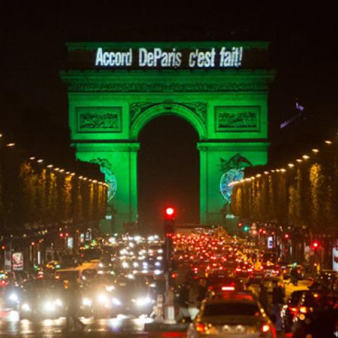 The Arc de Triomphe in Paris, France, is illuminated in green to celebrate the entry into force of the Paris Agreement, November 4, 2016 (U.S. Department of State)