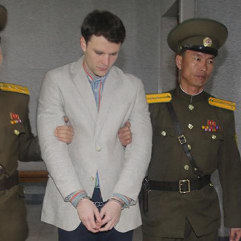 Otto Warmbier arrives at a court for his trial in Pyongyang, North Korea, March 16, 2015 (Xinhua/Lu Rui via Getty Images)