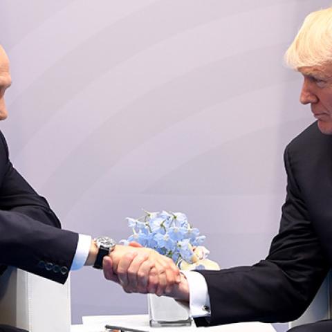 President Donald Trump and Russian President Vladimir Putin shake hands during a meeting on the sidelines of the G20 Summit in Hamburg, Germany, July 7, 2017 (SAUL LOEB/AFP/Getty Images)