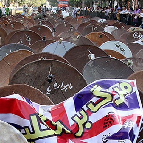 Satellite dishes displayed in street of the city of Shiraz before being destroyed by the Iranian army, September 28, 2013 (MOHSEN TAVARO/AFP/Getty Images)