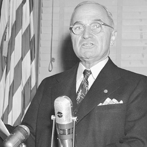 President Truman reading a statement warning that the U.S. is considering using the atomic bomb in the Korean War, November 30, 1950 (Bettmann Archives)