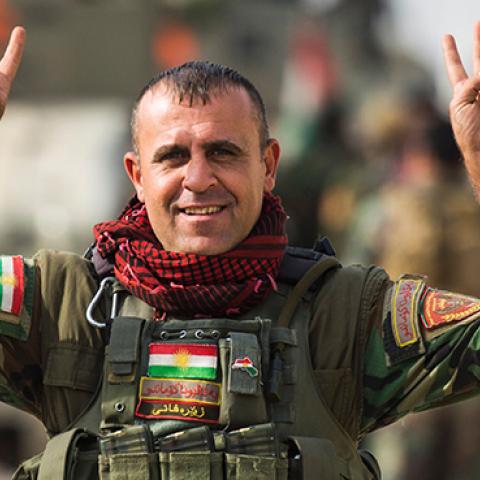 Peshmerga fighter flashes the V-sign after combat against Islamic State in Bashiqa, November 9, 2016 (ODD ANDERSEN/AFP/Getty Images)
