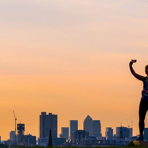 A woman takes a selfie on Primrose Hill, London, August 16, 2017 (Paul Davey / Barcroft Images / Barcroft Media via Getty Images)