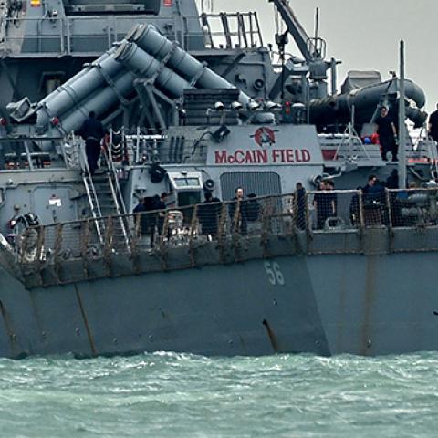  USS John S. McCain, with a hole on its portside after a collision with an oil tanker, August 21, 2017 (ROSLAN RAHMAN/AFP/Getty Images)