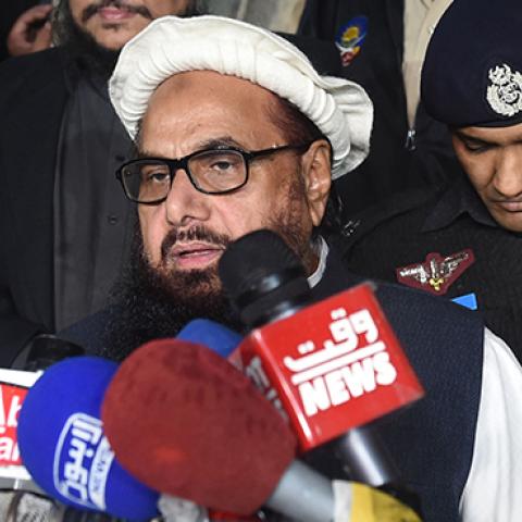 Hafiz Saeed, the Pakistani leader of Jamaat-ud-Dawa, speaks to the press after being placed under 'preventative detention' by Pakistan, January 31, 2017 (ARIF ALI/AFP/Getty Images)