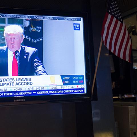 A television at the New York Stock Exchange shows President Trump announcing withdrawal from Paris Climate Accord, June 1, 2017 (BRYAN R. SMITH/AFP/Getty Images)