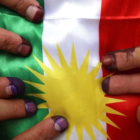 Members of a Kurdish Peshmerga battalion show their ink-stained fingers after voting in the Kurdish independence referendum, September 25, 2017 (SAFIN HAMED/AFP/Getty Images)