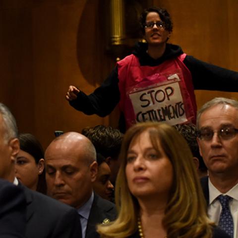 Anti-settlements demonstrator interrupts David Friedman at a hearing in front of the Senate Committee on Foreign Relations, February 16, 2016 (Robinson Chavez/The Washington Post via Getty Images)