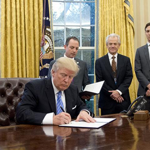President Trump signing Executive Orders, January 23, 2017 (Ron Sachs - Pool/Getty Images)