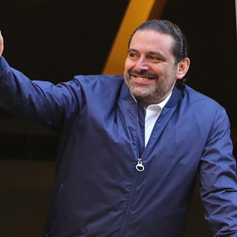 Former Lebanese prime minister Saad Hariri greets his supporters upon his arrival at his home in Beirut on November 22, 2017 (STR/AFP/Getty Images)