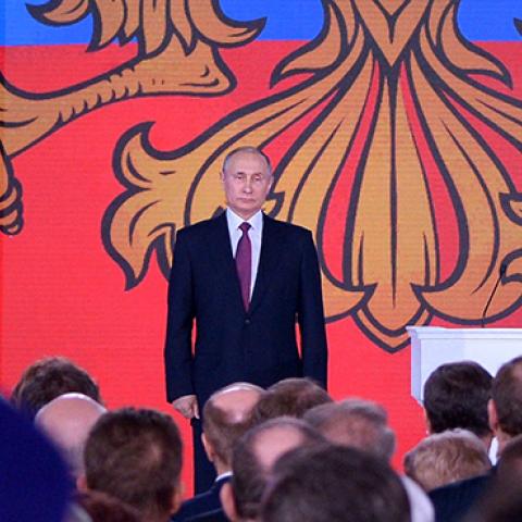 Russian President Putin stands addressing the Federal Assembly in Moscow, March 1, 2018 (ALEXEY NIKOLSKY/AFP/Getty Images)