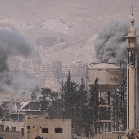 Smokes rise after Assad Regime forces carried out airstrikes in Eastern Ghouta, April 7, 2018 (Halil el-Abdullah/Anadolu Agency/Getty Images)