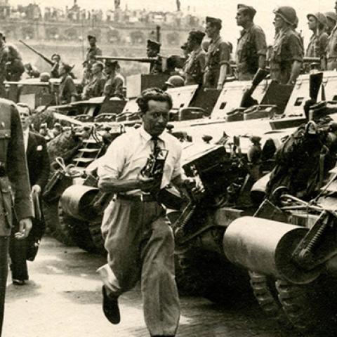 Charles de Gaulle salutes Free French tanks and their crews after the liberation of Paris, August 1944 (Rykoff Collection/Getty Images)