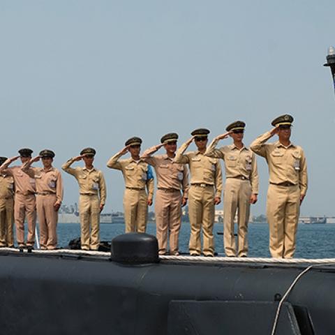 Taiwanese navy staffs salute from a US-made Guppy class submarine at the Tsoying navy base in southern Kaohsiung, September 30, 2014 (SAM YEH/AFP/Getty Images)