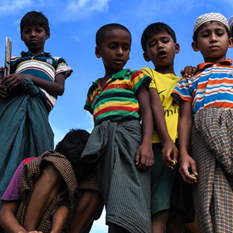 Rohingya refugee children look on at the Kutupalong camp in Ukhia, August 12, 2018 (CHANDAN KHANNA/AFP/Getty Images)