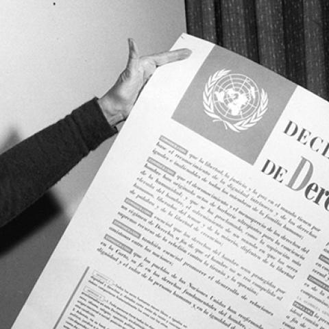 Eleanor Roosevelt displays a Spanish language version of the Universal Declaration 1949 (Universal History Archive/UIG via Getty Images)