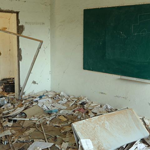 Yemeni member of a school administration inspects the damage on the first day of the new academic year, September 16, 2018 (AHMAD AL-BASHA/AFP/Getty Images)