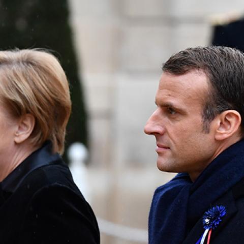 President Emmanuel Macron and German Chancellor Angela Merkel arrive at the Elysee Palace after the ceremony for the Centenary of the World War I Armistice in Paris, France on November 11, 2018. (Mustafa Yalcin/Anadolu Agency/Getty Images)