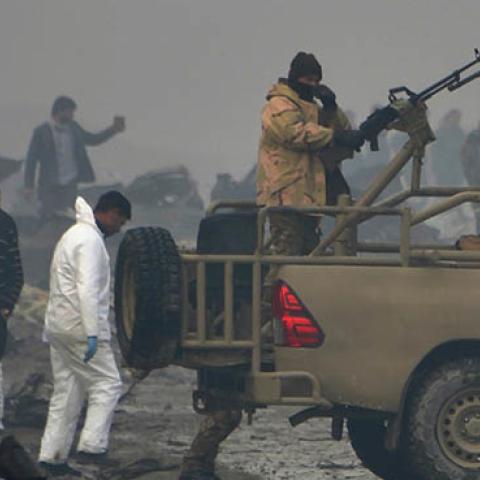 Afghan security forces and investigators gather at the site of a suicide bomb attack outside a British security firm's compound in Kabul on November 30, 2018. At least 10 people were killed. (NOORULLAH SHIRZADA/AFP/Getty Images)