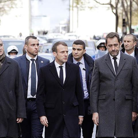 French President Emmanuel Macron walks a street of Paris on December 2, 2018, a day after clashes during a protest of Yellow vests (Gilets jaunes) against rising oil prices and living costs. (Photo credit: GEOFFROY VAN DER HASSELT/AFP/Getty Images)