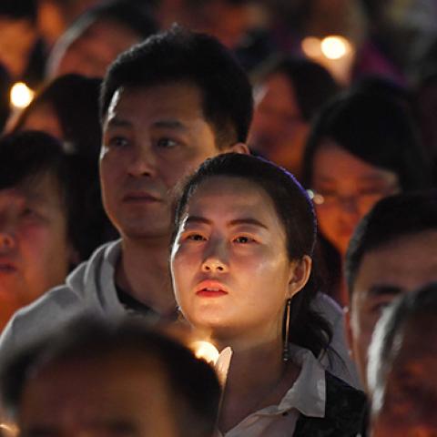 Catholic worshippers attend a mass on Holy Saturday, part of Easter celebrations at Beijing's government sanctioned South Cathedral on March 31, 2018. (Photo credit: GREG BAKER/AFP/Getty Images)