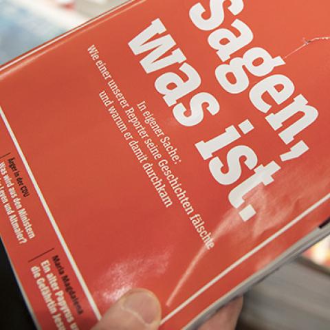A man holts the latest issue of German newsweekly Der Spiegel with a cover page that reads: 'To say, what is' at a kiosk on December 22, 2018 in Cologne, Germany. (Photo by Thomas Lohnes/Getty Images)