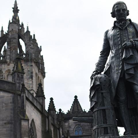 A statue of Scottish economist Adam Smith stands on the Royal Mile in Edinburgh, Scotland. (OLI SCARFF/AFP/Getty Images)