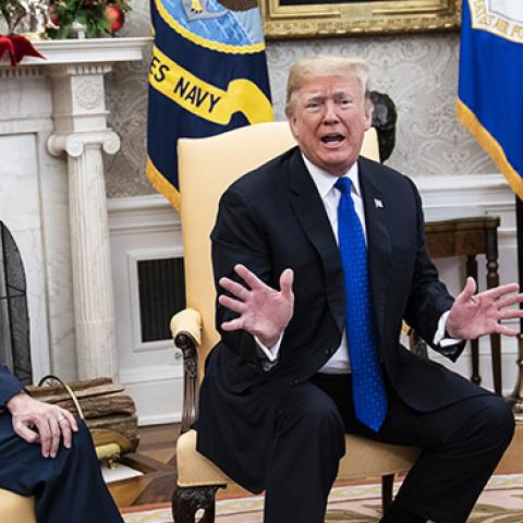 President Donald Trump debates with then House Minority Leader Nancy Pelosi Senate Minority Leader Chuck Schumer as Vice President Mike Pence listens during a meeting on Tuesday, Dec. 11, 2018 in Washington, DC. (Jabin Botsford/Getty Images)