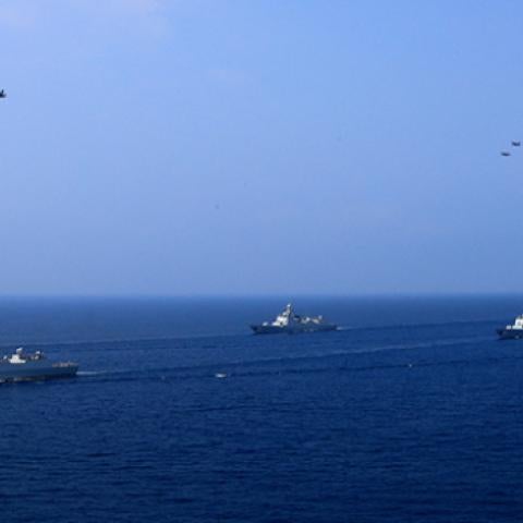 A PLA Navy fleet including the aircraft carrier Liaoning, submarines, vessels and fighter jets take part in a review in the South China Sea on April 12, 2018 in At Sea, China. (VCG via Getty Images)