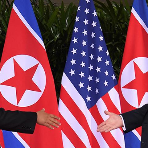 North Korea's leader Kim Jong Un shakes hands with U.S. President Donald Trump at the start of their historic U.S.-North Korea summit, at the Capella Hotel on Sentosa island in Singapore on June 12, 2018. (SAUL LOEB/AFP/Getty Images)