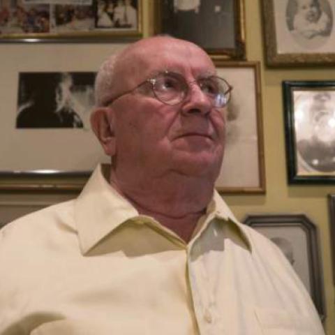 Holocaust and Tree of Life synagogue survivor Judah Samet looks at photographs of his family, August 27, 2018 in Pittsburgh. (ANDREW RUSSELL/TRIBUNE-REVIEW)