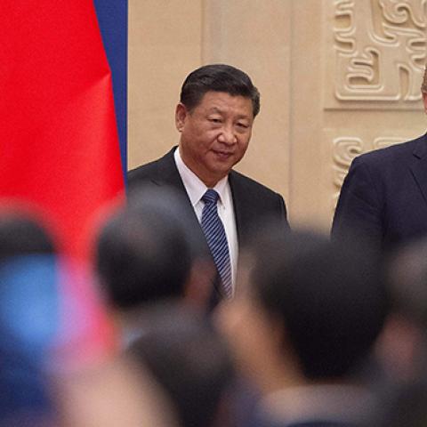 U.S. President Donald Trump and China's President Xi Jinping arrive at a business leaders event inside the Great Hall of the People in Beijing on November 9, 2017.  (NICOLAS ASFOURI/AFP/Getty Images)