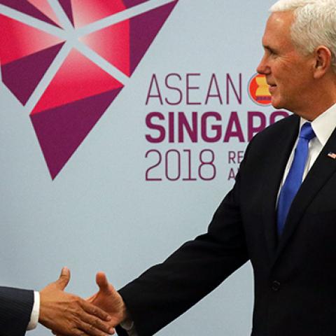 U.S.Vice President Mike Pence shakes hands with Indonesia's President Joko Widodo during a bilateral meeting on the sidelines of the 33rd Association of Southeast Asian Nations (ASEAN) summit in Singapore on November 14, 2018. (ATHIT PERAWONGMETHA/AFP)