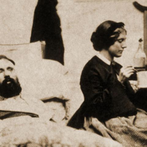 Two wounded Federal soldiers being cared for by a nurse during the Civil War. (PHOTO: UNCREDITED)