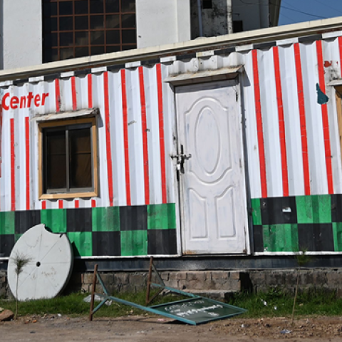 A Pakistani man walks past closed offices of the Falah-e-Insaniat Foundation -- an organisation believed by the UN to be a front for the banned Islamist militant group Lashkar-e-Taiba -- in Islamabad on March 6, 2019. (AAMIR QURESHI/AFP/Getty Images)