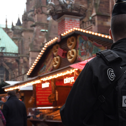 An armed gendarme stands guard at Strasbourg's Christmas market, on its reopening day, on December 14, 2018, one day after French police shot dead the gunman who killed three people there. (PATRICK HERTZOG/AFP/Getty Images)