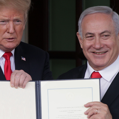 President Donald Trump and Prime Minister of Israel Benjamin Netanyahu (R) show members of the media the proclamation recognizing Israel’s sovereignty over Golan Heights on March 25, 2019 in Washington, DC. (Alex Wong/Getty Images)