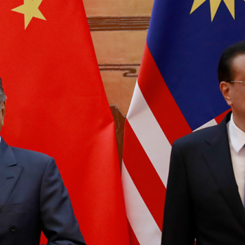 Malaysian Prime Minister Mahathir Mohamad and his Chinese counterpart Li Keqiang arrive for a signing ceremony at the Great Hall of the People in Beijing, China, August 2018. (Pool/Getty Images)