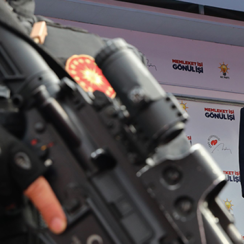 Turkish President Recep Tayyip Erdogan speaks as a security staff member stands guard in foreground during a rally of Justice and Development Party (AK Party) in Ankara, Turkey, on March 28, 2019. (Anadolu Agency/Getty Images)