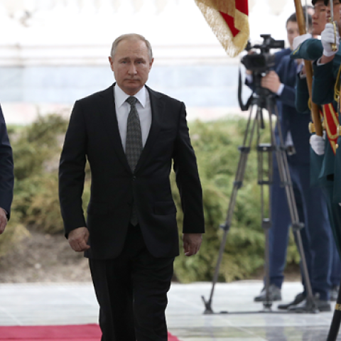 Russian President Vladimir Putin followed by Kyrgyz President Sooronbay Jeenbekov attend the welcoming ceremony prior to their talks in Bishkek, Kyrgyzstan on March 28, 2019. (Mikhail Svetlov/Getty Images)