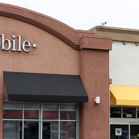 A T-Mobile and Sprint store sit side-by-side in a strip mall on April 30, 2018 in El Cerrito, California. (Justin Sullivan/Getty Images)