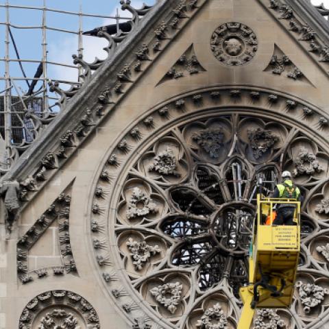 Technicians work in a crane next to Notre Dame cathedral following the massive fire earlier this month, on April 29, 2019 in Paris, France. (Chesnot/Getty Images)