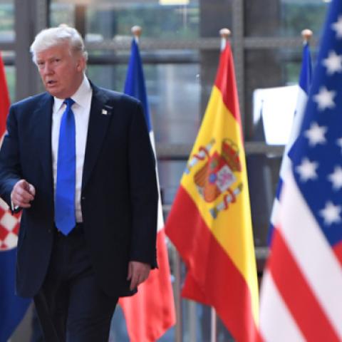 US President Donald Trump gestures as he speaks to European Council President Donald Tusk upon his arrival at EU headquarters in Brussels, on May 25, 2017. (EMMANUEL DUNAND/Getty Images) 